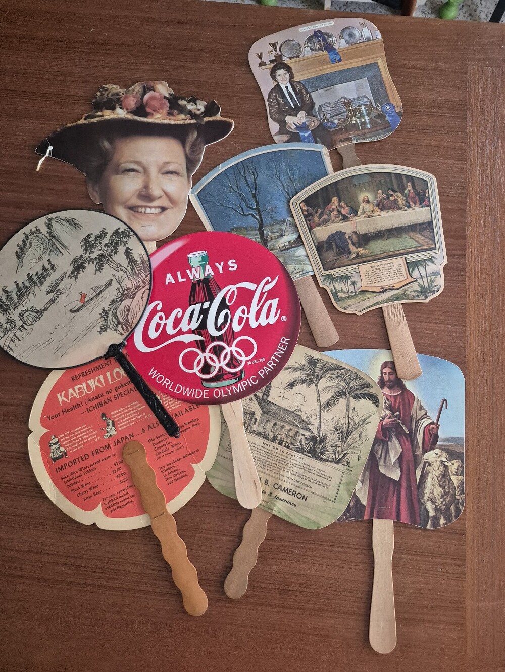 Assorted vintage advertising fans
